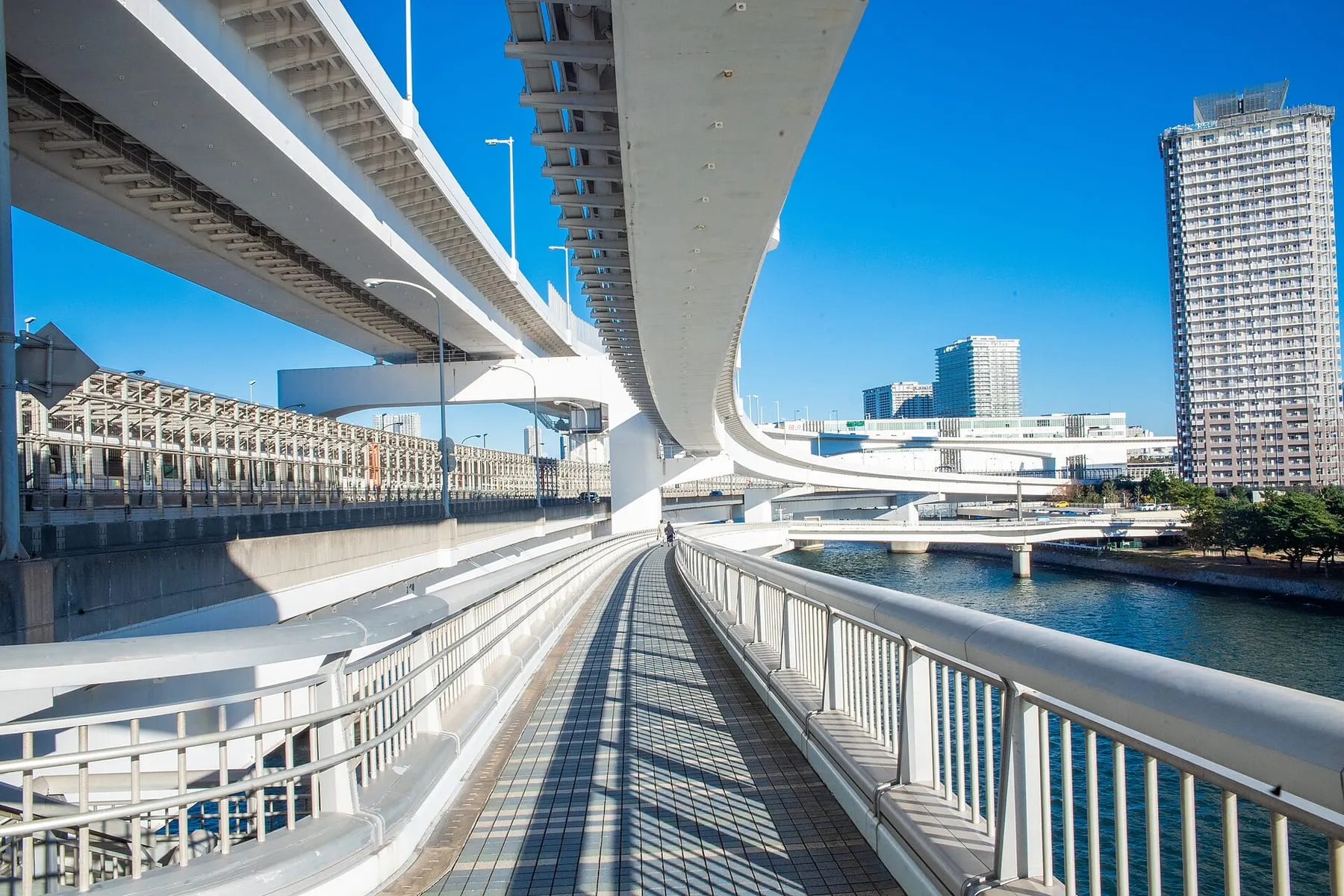Walking the Rainbow Bridge promenade above Tokyo Bay